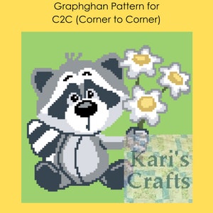May include: A gray and white cartoon raccoon holding a bouquet of white flowers with yellow centers. The background is a light green color. The text "Kari's Crafts" is in the lower right corner of the image.