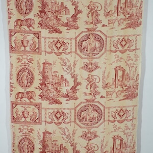 May include: Red and white fabric with a repeating pattern of stylized figures, animals, and architectural elements. The pattern includes lions, elephants, birds, and a tower.