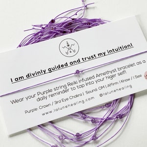 May include: Purple string bracelet with amethyst beads. The bracelet is on a white card with the text "I am divinely guided and trust my intuition! Wear your Purple string Reiki infused Amethyst bracelet as a daily reminder to tap into your higher self! Purple: Crown / 3rd Eye Chakra | Sound: OM | Affirm: I Know / I See www.lalunehealing.com @lalunehealing".