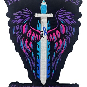 May include: Embroidered patch with a black background, featuring a white sword with blue and pink flames, purple wings, and a blue ribbon. The text "Borrowed Angels Charity Riders™" is in purple.