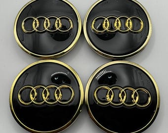 Juego de 4 tapacubos centrales de aleación Audi en negro y dorado con aro cromado de 61 mm (4M0601170). Compatibles con A3, A4 y A5.
