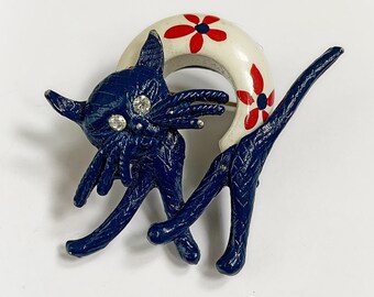 Vintage Navy-Blue Enamel Cat Brooch with Rhinestone Eyes and White Arched Back with Floral Design