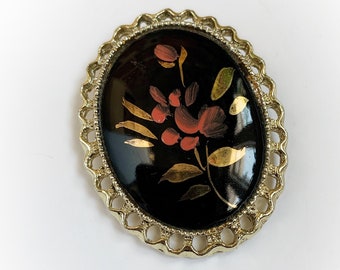 Vintage Hand Painted Gold and Orange Flower Brooch Pendant on Black Oval Cabochon in Decorative Gold Tone Metal Frame