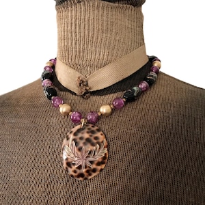 Vintage Glass and Plastic Bead Necklace with Carved Tiger Cowrie Shell Pendant