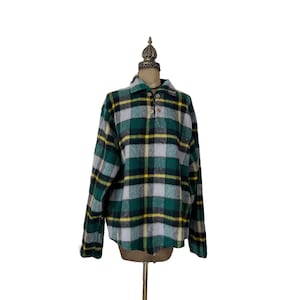 May include: A green, yellow, and white plaid flannel shirt with a button-up collar and long sleeves.