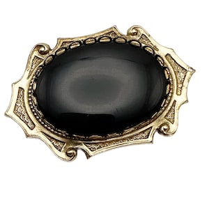 Vintage Black Oval Cabochon Brooch in Decorative Gold Tone Metal Frame