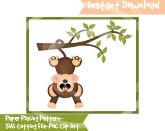 May include: A brown monkey with pink cheeks hangs upside down from a green branch. The monkey has large, black eyes and a small, brown nose. The branch has green leaves.