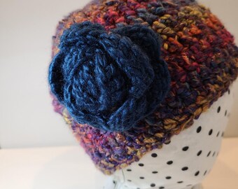 Variegated Crocheted Hat in Magenta, Blue & Pumpkin  with Removable Sapphire Blue Flower