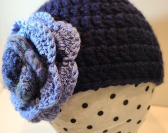 Navy Crocheted Hat Adorned With A Variegated Crocheted Flower