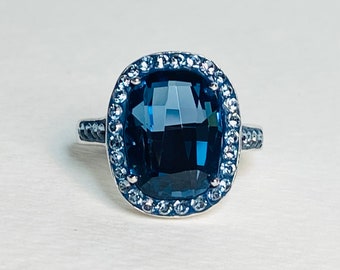 Montana blue Swarovski crystal halo style band ring in sterling silver