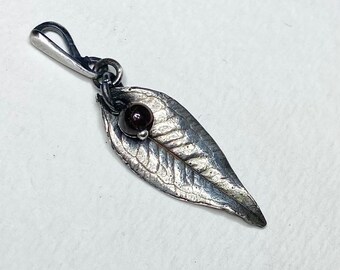 Fine silver leaf pendant with garnet accent