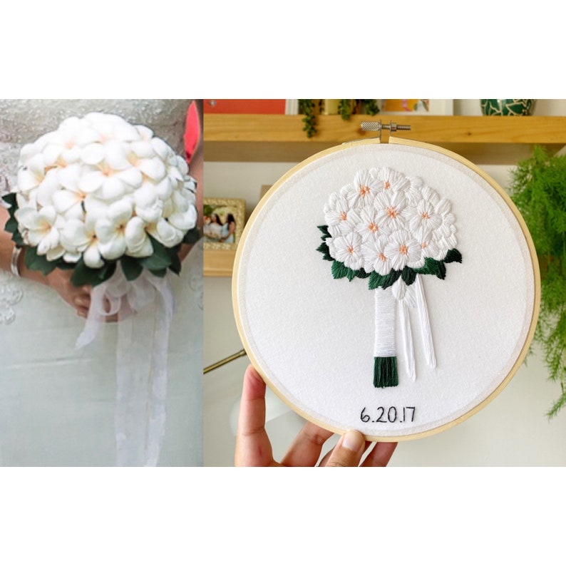 May include: White embroidered bouquet of flowers in a wooden embroidery hoop with the date 6.20.17 written below the bouquet.