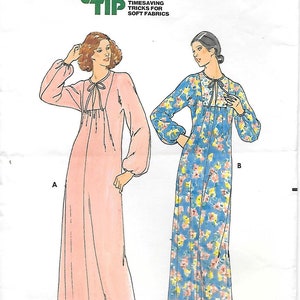 May include: Vintage Butterick pattern 5982 featuring two long, flowing nightgowns. One is a solid pale pink, the other a blue floral print. The pattern includes a "Quick Tip" for soft fabrics and is sized "Petite".