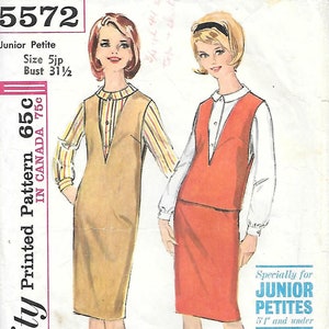 May include: Vintage Simplicity pattern 5572 for Junior Petites. The pattern features two dress designs: a tan dress over a striped shirt and a red dress over a white shirt. The bust size is 80 cm. The pattern is for those 155 cm and under.