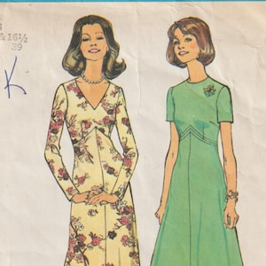 May include: Simplicity pattern 6935 showing two dress designs. One is a long, flowing dress with a V-neck and floral print. The other is a short-sleeved, knee-length dress. The text "Look Slimmer pattern" is at the bottom.