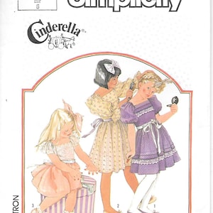 May include: Simplicity sewing pattern featuring a Cinderella theme. The illustration shows three young girls in dresses, with the Cinderella logo at the top. The pattern number is 7347, and the size is 6.