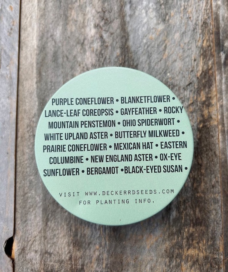 May include: A green circle with a list of flower names, including Purple Coneflower, Blanketflower, Lance-Leaf Coreopsis, Gayfeather, Rocky Mountain Penstemon, Ohio Spiderwort, White Upland Aster, Butterfly Milkweed, Prairie Coneflower, Mexican Hat, Eastern Columbine, New England Aster, Ox-Eye Sunflower, Bergamot, and Black-Eyed Susan. The text also includes the website address "www.deckerrdseeds.com" and the phrase "For Planting Info."