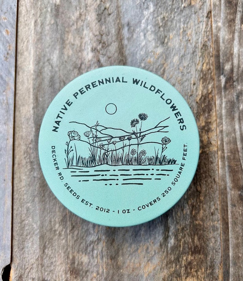 May include: A teal blue round tin with black text that reads "Native Perennial Wildflowers Decker Rd. Seeds Est. 2012 - 1 oz - Covers 250 Square Feet". The tin has a black and white illustration of wildflowers and a sunset.
