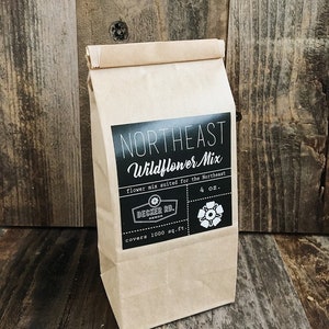 May include: A brown paper bag with a black label that says "Northeast Wildflower Mix" and includes the text "flower mix suited for the Northeast", "Decker Rd.", "covers 1000 sq.ft.", and "4 oz.".