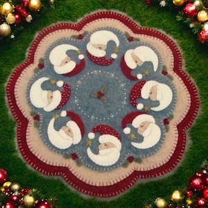 May include: A blue and white felt Christmas tree skirt with a red border and eight white felt Santa faces around the edge.