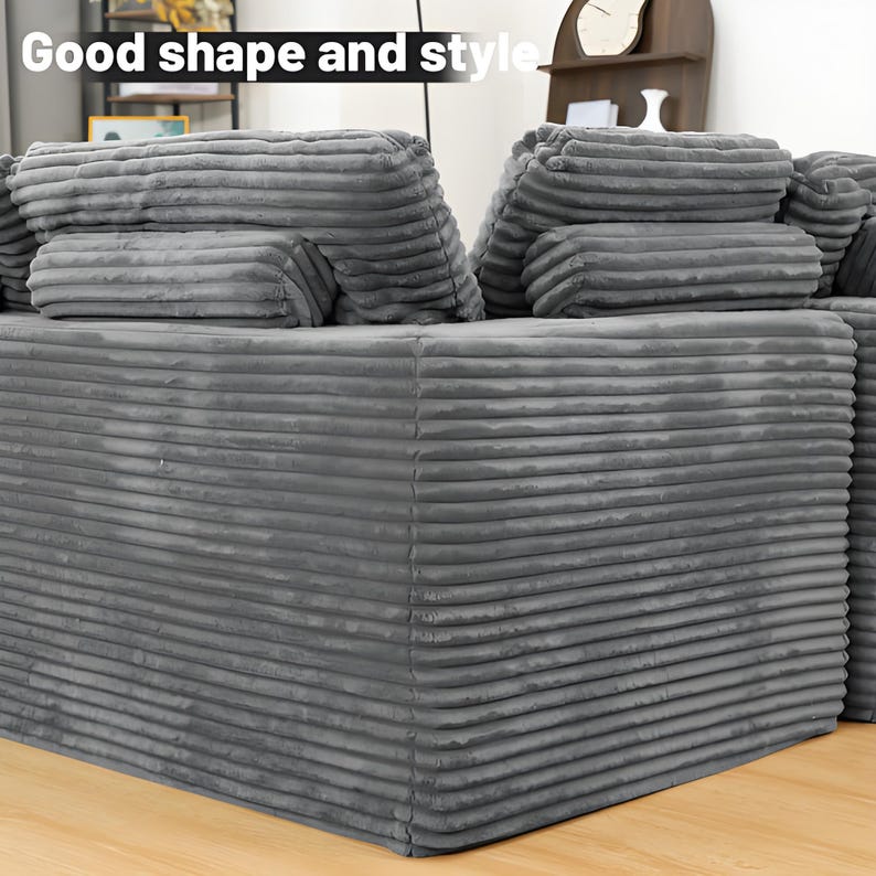 May include: A gray corduroy sofa with multiple cushions. The sofa has a ribbed texture and a low profile. The text "Good shape and style" is visible in the upper left corner. The sofa is a neutral color and appears to be comfortable.