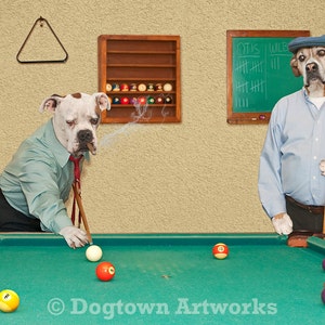 May include: Two dogs playing pool. One dog is wearing a blue shirt and a hat, the other dog is wearing a green shirt and a tie. The dog in the green shirt is holding a pool cue and is about to take a shot. The dog in the blue shirt is standing behind the table, watching the game. The pool table is green and has a felt surface. There are balls on the table, including a white cue ball, a yellow ball, a red ball, and a purple ball. The table is in a room with a wooden floor and a brown wall. There is a scoreboard on the wall that says "Otis Wilds".
