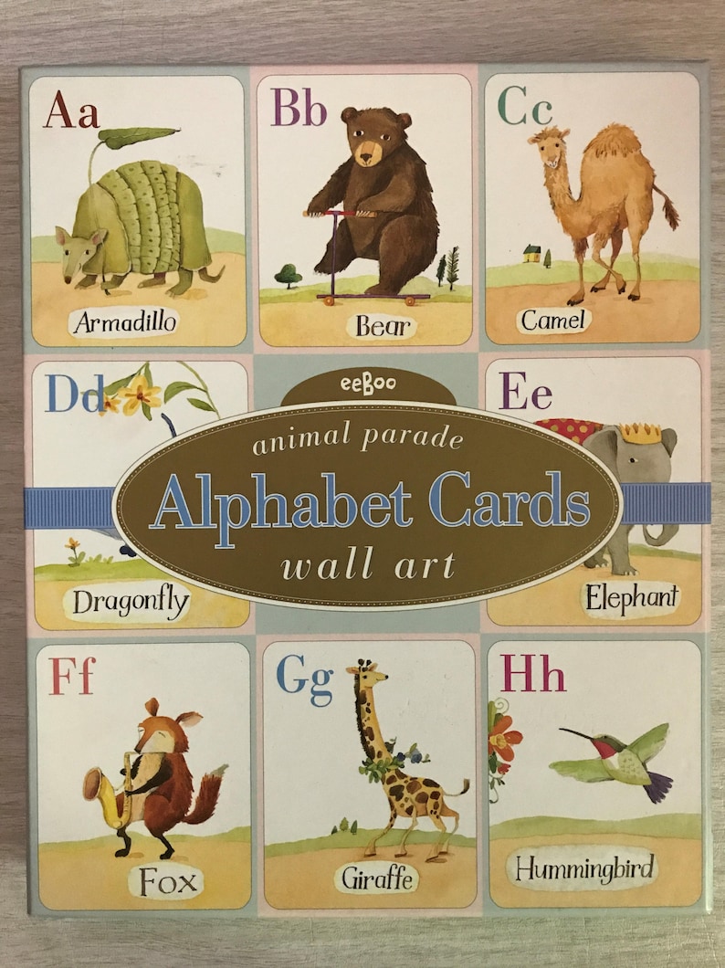 May include: A set of alphabet cards featuring colorful illustrations of animals. Each card has a letter of the alphabet and the name of the animal. The cards are part of the eeBoo animal parade wall art collection.