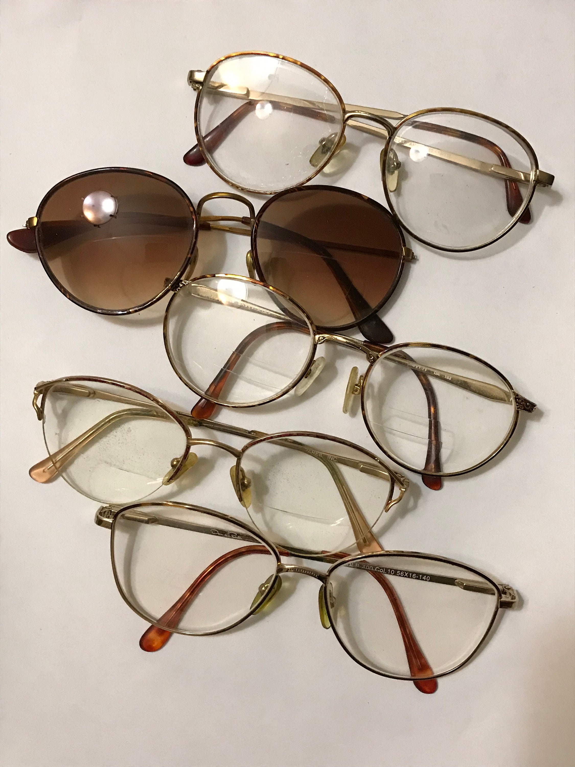 Black eyeglasses with gold trim sales