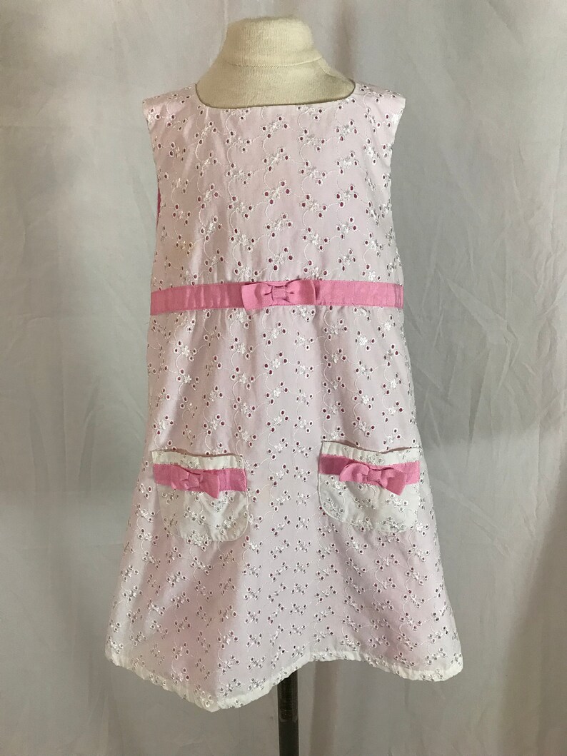 Sizs 4T Baby Togs Toddler Girl\u2019s A Line Dress White Eyelet Lined in Pink with Grosgrain Ribbon Trim and Patch Pockets