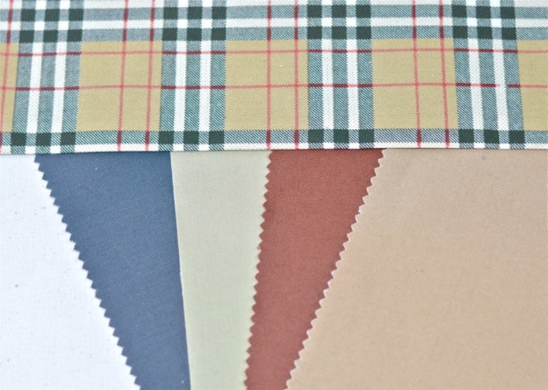 May include: Five fabric swatches in different colors and textures. The swatches are arranged horizontally, with a plaid fabric at the top. The swatches are white, blue, beige, brown, and tan.