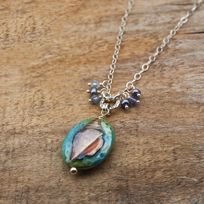 Nautilus shell necklace Austrian crystal and freshwater pearls 20 inches long sterling silver chain