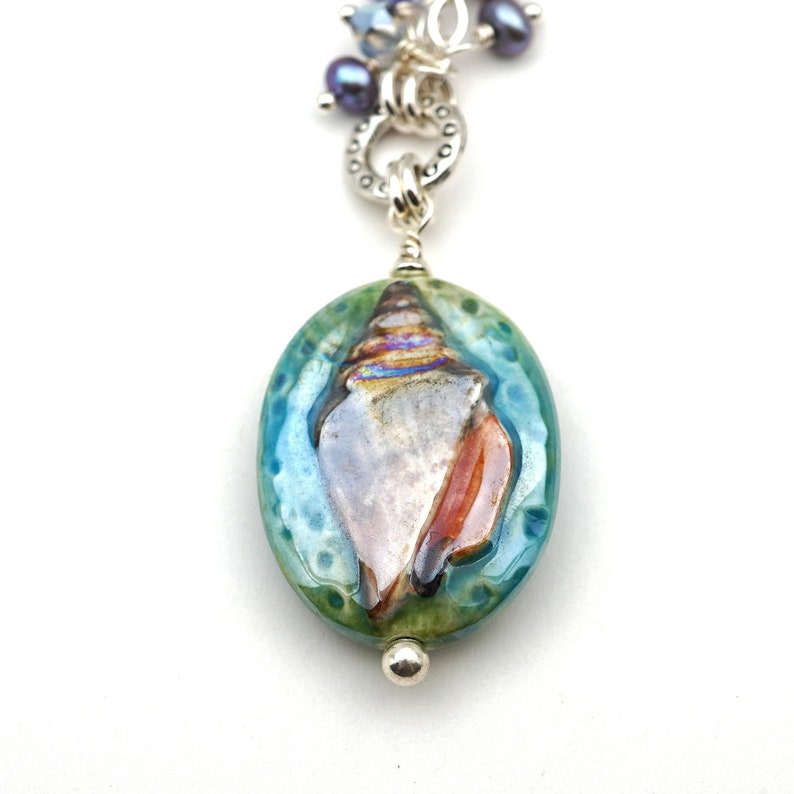Nautilus shell necklace Austrian crystal and freshwater pearls 20 inches long sterling silver chain