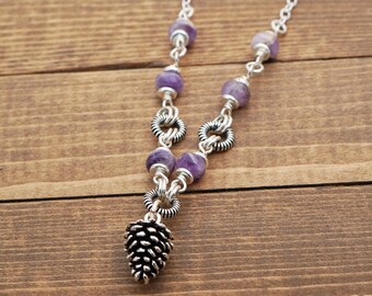 Purple pinecone necklace with faceted chevron amethyst beads and silver tone chain, 21 inches long