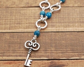 Key necklace with blue apatite beads and silver tone chain, 22 inches long