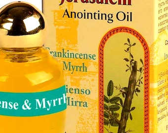 May include: A small bottle of anointing oil with a gold cap and a green label that says "Blessing from Jerusalem Anointing Oil Frankincense Myrrh" and "Holyland Anointing Oils".