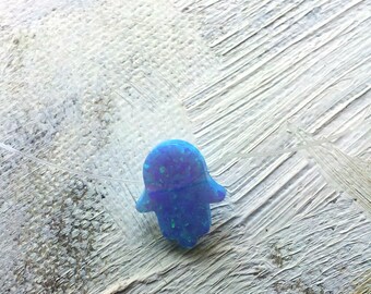 Blue opal hamsa necklace on a clear string