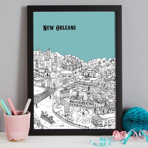 May include: Black and white line drawing of the New Orleans skyline with a light blue background. The drawing includes buildings, a river, a bridge, and a steamboat. The text "NEW ORLEANS" is at the top of the image.
