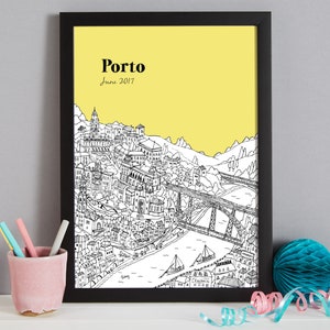 May include: Black framed print featuring a detailed black and white illustration of Porto, Portugal, set against a yellow background. The word "Porto" and the date "June 2017" are printed at the top. The artwork depicts buildings, bridges, and boats.