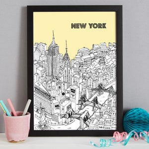 May include: Black framed art print featuring a detailed black and white illustration of the New York City skyline, including iconic landmarks like the Empire State Building and the Statue of Liberty, set against a pale yellow background. The word "NEW YORK" is printed at the top.