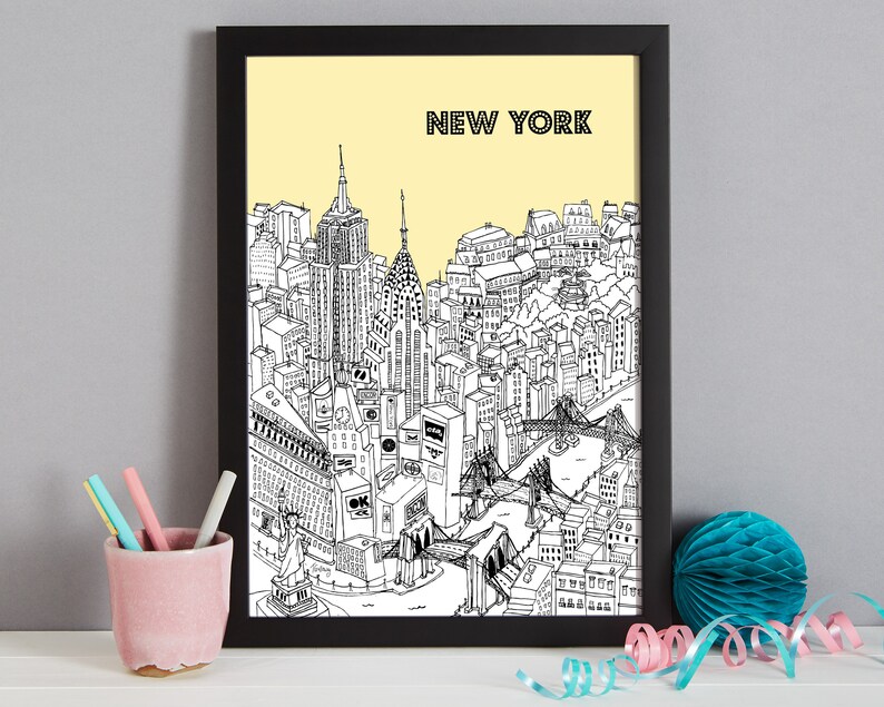 May include: Black framed art print featuring a detailed black and white illustration of the New York City skyline, including iconic landmarks like the Empire State Building and the Statue of Liberty, set against a pale yellow background. The word "NEW YORK" is printed at the top.
