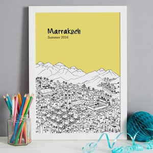 May include: A black and white line drawing of the city of Marrakech, Morocco, with a yellow background. The text "Marrakech" and "Summer 2016" is printed below the drawing.