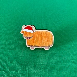 Festive orange highland cow wooden pin badge image 1