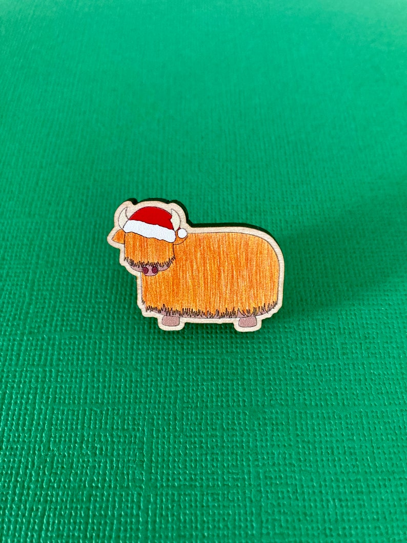 Festive orange highland cow wooden pin badge image 1