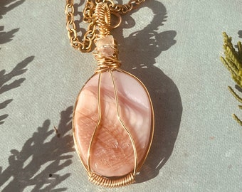 Gold wire wrapped shell pendant with fluorite accent stone on gold chain