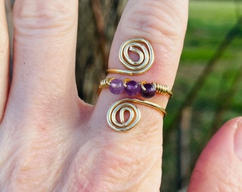 wire wrapped gold spiral ring with amethyst stones