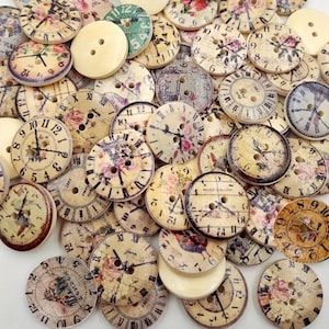 May include: A collection of vintage-style wooden buttons, each featuring a clock face design with Roman numerals and floral accents. The buttons vary in color, with cream, beige, and faded hues. Some buttons have the text "LONDON" printed on them.
