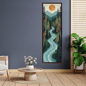 Peut inclure: Une impression d'art mural encadrée, haute et verticale, représentant une rivière sinueuse traversant une forêt dense de pins verts et orange, avec en arrière-plan des montagnes bleues et une grande pleine lune dorée et orange.