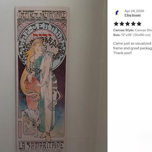The image is a framed artwork titled "La Samirite à la l'arcole" by the artist Frédéric Auguste Renoir. The artwork is a painting of a woman with a large headdress, and it is displayed on a wall. The image also includes a review from eBay stating that the painting is a "Great product" and has been "rated 5 stars".