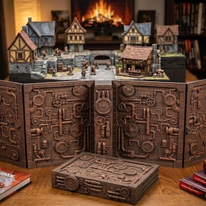 May include: A brown, steampunk-themed tabletop gaming set. The set includes a multi-panel game master screen, a dice box, and a miniature fantasy village. The screen and box feature intricate gear and pipe designs. A Player's Handbook is visible.