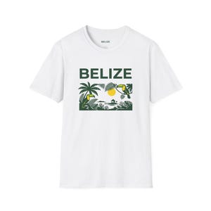 May include: White t-shirt with the word "BELIZE" in green block letters above a green graphic of a tropical scene. The graphic includes palm trees, toucans, a yellow sun, and foliage.